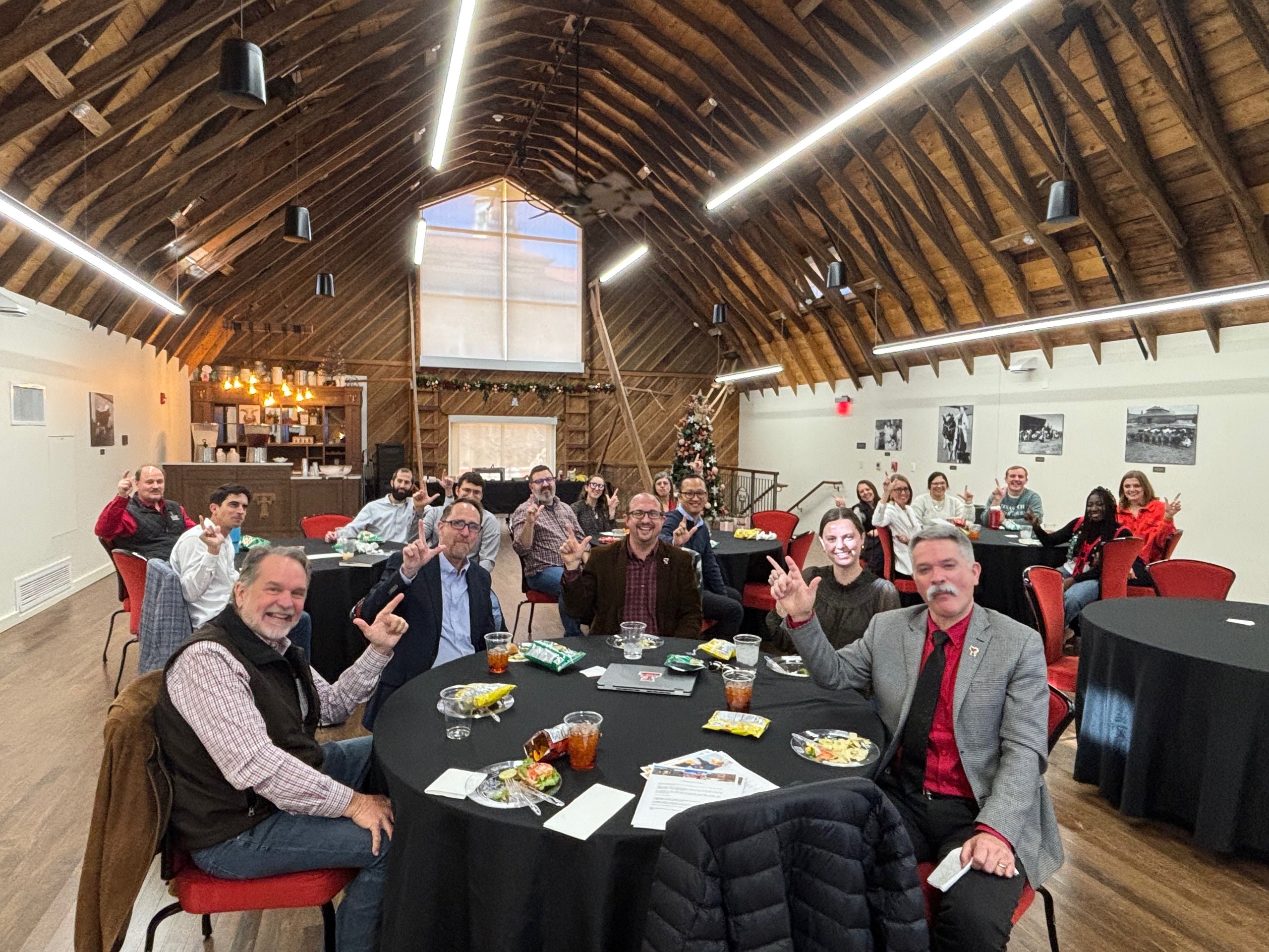 Network members gathered around tables at a fellowship dinner